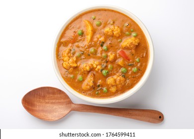 MIX VEGETABLE CURRY- Indian Recipe, Mixed Veg Containing Carrots, Cauliflower, Green Peas And Beans With Traditional Masala And Curry, Red Hot And Spicy Served In A Ceramic Bowl