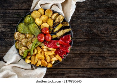 Mix vegetable fried with eggplant, tomato, potatoes, zucchini and pepper. karisik kizartma . Vegan and vegetarian food to the table.  - Shutterstock ID 2179920645