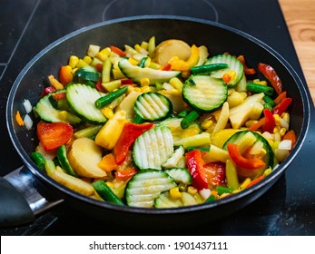 Mix of vegetables cooking in frying pan 