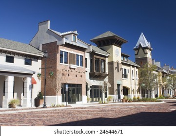 Mixed Architecture Styles Commercial Strip Mall With Brick Paver Parking