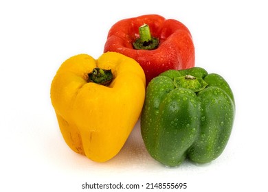 mixed capsicum red, green, yellow colors isolated in white background with copy space shot using studio lights