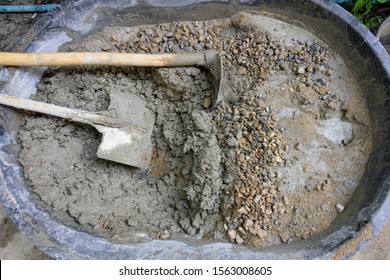 Mixed Cement Mortar With Hoe And Leak Inside Big Bucket On Floor 