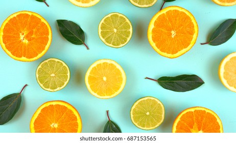 Mixed citrus fruit on aqua blue table overhead, slices knolling flat lay.. 