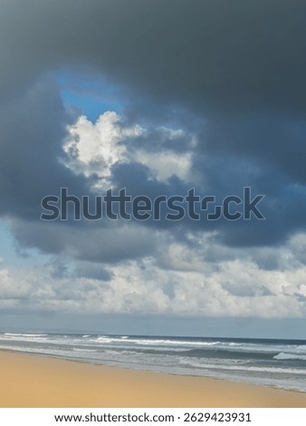 Mixed Clouds Over Surf Beach vert