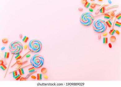 Mixed collection of colorful candy, on pink background. Flat lay, top view - Powered by Shutterstock