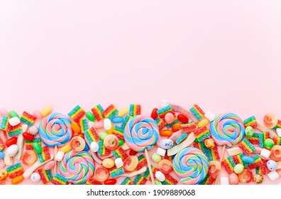 Mixed Collection Of Colorful Candy, On Pink Background. Flat Lay, Top View