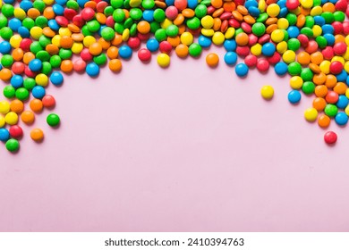 Mixed collection of colorful candy, on colored background. Flat lay, top view. frame of colorful chocolate coated candy. - Powered by Shutterstock