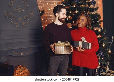 Mixed Couple Having Fun And Spending Christmas Together