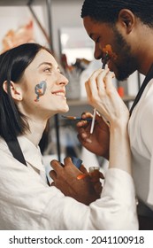 Mixed Couple Painting Picture In Workshop