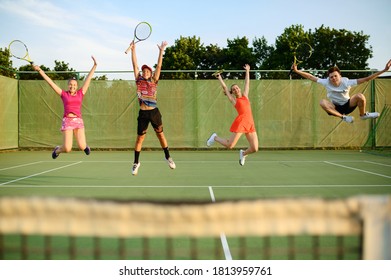 Mixed doubles tennis, players jump near the net - Powered by Shutterstock