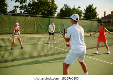 Mixed doubles tennis training, outdoor court