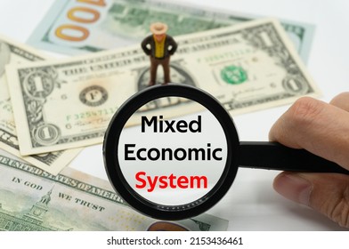 Mixed Economic System.Magnifying Glass Showing The Words.Background Of Banknotes And Coins.basic Concepts Of Finance.Business Theme.Financial Terms.