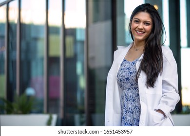 Mixed Ethnicity College Grad Student In The Medical Field, Possibly Intern For Dentistry, Psychiatry, Medicine, In Lab Coat