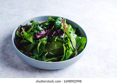 Mixed Fresh Salad Leaves In A Blue Bowl Top View