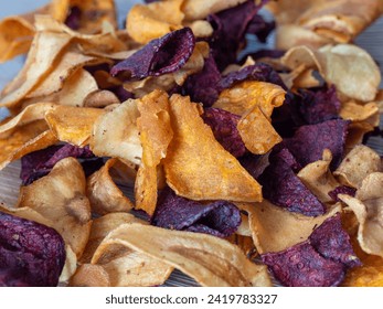Mixed fried vegetable chips. Crunchy colorful organic vegetable snack closeup. Ingredients of a healthy diet