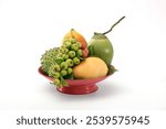 Mixed fruits tray soursop custard apple, coconut, mango, papaya, fig pineapple traditional Vietnamese Lunar new year food for worship. Chinese New year concept lucky fruit tray on white background