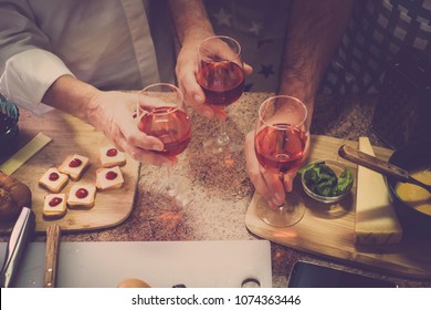 Mixed Generation Mother Father Son With A Cup Of Wine At Home In Aerial Picture. A Lot Of Food On The Table To Celebrate And Stay Together.