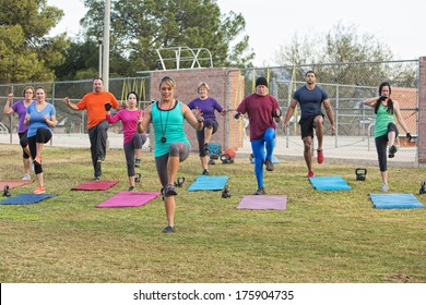 Mixed group of mature adults in boot camp exercise - Powered by Shutterstock