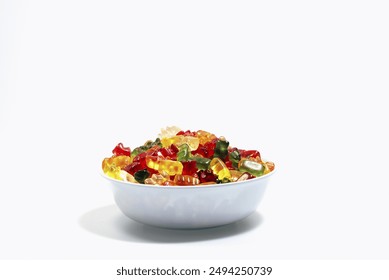 Mixed gummy bears of different colours in a white bowl. - Powered by Shutterstock