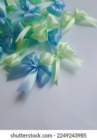 Mixed light blue light green ribbon made of satin ribbon. handmade. Ribbon hampers. Isolated on a white background. - Shutterstock ID 2249243985