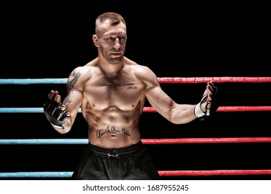 Mixed martial artist posing in boxing ring. Concept of mma, ufc, thai boxing, classic boxing. Mixed media