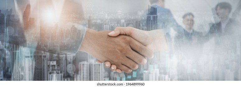 Mixed media effect Double exposure,businessman handshake deal to partner,successfully negotiated and commercial cooperation,business icon and diagrams chart,cityscape background,website header banner