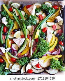 Mixed Mediterranean Vegetables Mix With Feta Cheese, Tik Tok Food Roasted In The Oven. Fresh Vegetables On Sheet Pan. Colorful And Delicious Dish. Coating Of Oil Is Getting Veggies Crispy And Tasty.