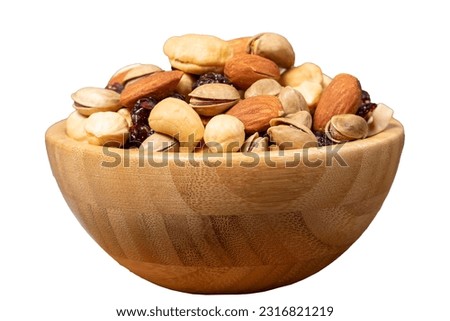 Mixed nuts isolated on white background. Special mixed nuts in wooden bowl. Hazelnut, almond, cashew, pistachio, dried blueberry. Superfood. Vegetarian food concept. healthy snacks