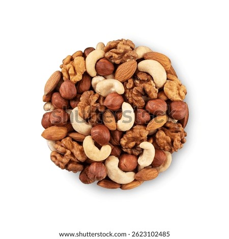Mixed nuts isolated on white background. Top view of tasty hazelnuts, cashews, almonds and walnuts