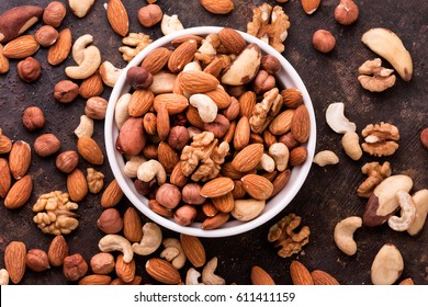  Mixed Nuts On Dark Background. Healthy Food And Snack. Top View.