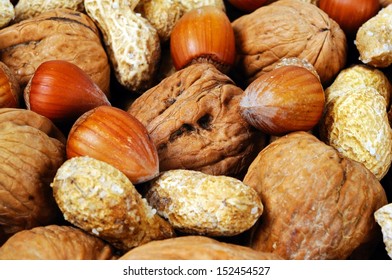 Mixed nuts in their shells (Monkey nuts, Walnuts and Hazelnuts), UK, Western Europe.