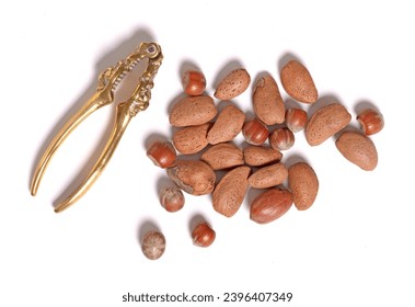 Mixed nuts with vintage nutcracker, isolated on white