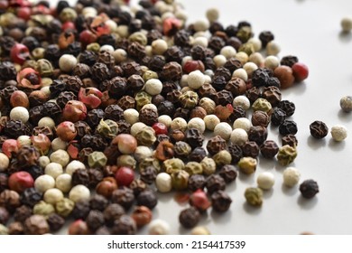 Mixed Peppercorns On A Plate. 