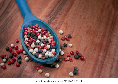 Mixed Peppercorns On A Spoon