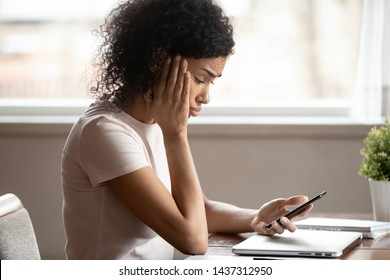 Mixed Race 30s Woman Pouted Lips Looking At Smartphone Frustrated By Received Sms Or Notification, Bad News Reading On Cell Phone Feels Upset, Waiting Message From Boyfriend, Negative Response Concept