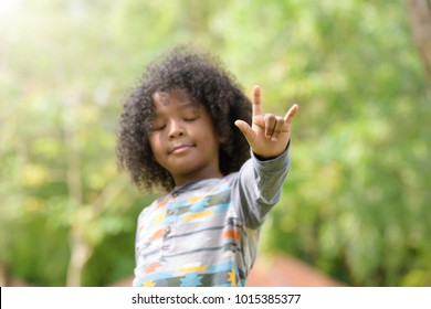 Mixed Race Boy Show I Love You Sign Language . Kids ,childhood Love Concept . Selective Focus At Finger  .