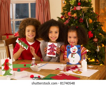 Mixed Race Children Making Christmas Cards