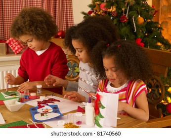 Mixed Race Children Making Christmas Cards