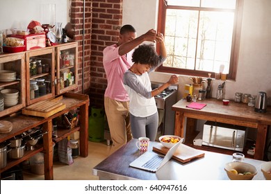 Mixed Race Couple Dancing In Kitchen, Elevated View