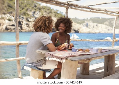 Mixed Race Couple Having A Meal By The Sea, Vertical, Ibiza