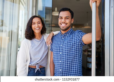 Mixed Race Couple Outside The Coffee Shop They Own