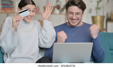 Mixed Race Couple Shopping Online With Laptop At Home 