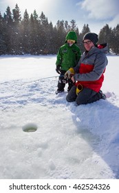 Mixed Race Family Ice Fishing