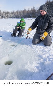 Mixed Race Family Ice Fishing