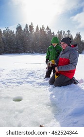 Mixed Race Family Ice Fishing