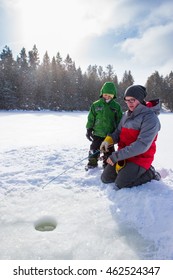 Mixed Race Family Ice Fishing