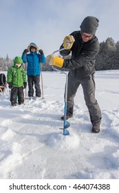 Mixed Race Family Ice Fishing