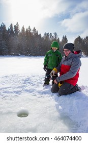 Mixed Race Family Ice Fishing