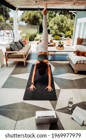 Mixed Race Female Teen Stretching Legs Practicing Yoga Outside Home