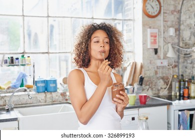 Mixed Race Girl Indulging Cheeky Face Eating Chocolate Spread From  Jar Using Spoon Savoring Every  Mouthful